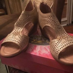 Eyelet cutout sandal.